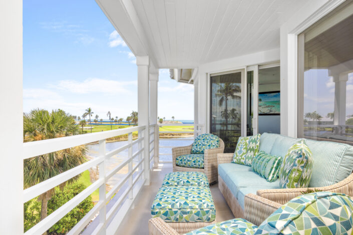 lands-end-penthouse-0S3A0722 Penthouse lanai with wicker seating overlooking the water on Captiva Island